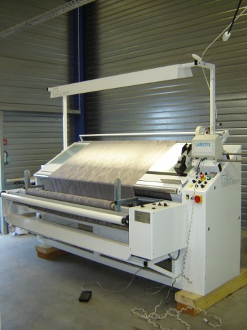Inspection machine for elastic fabrics