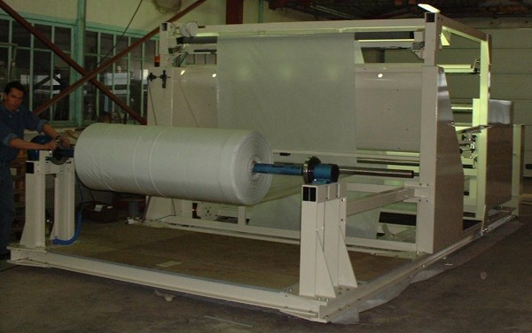 Inspection machine for technical weaving fabrics