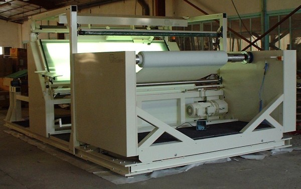 Inspection machine for technical weaving fabrics